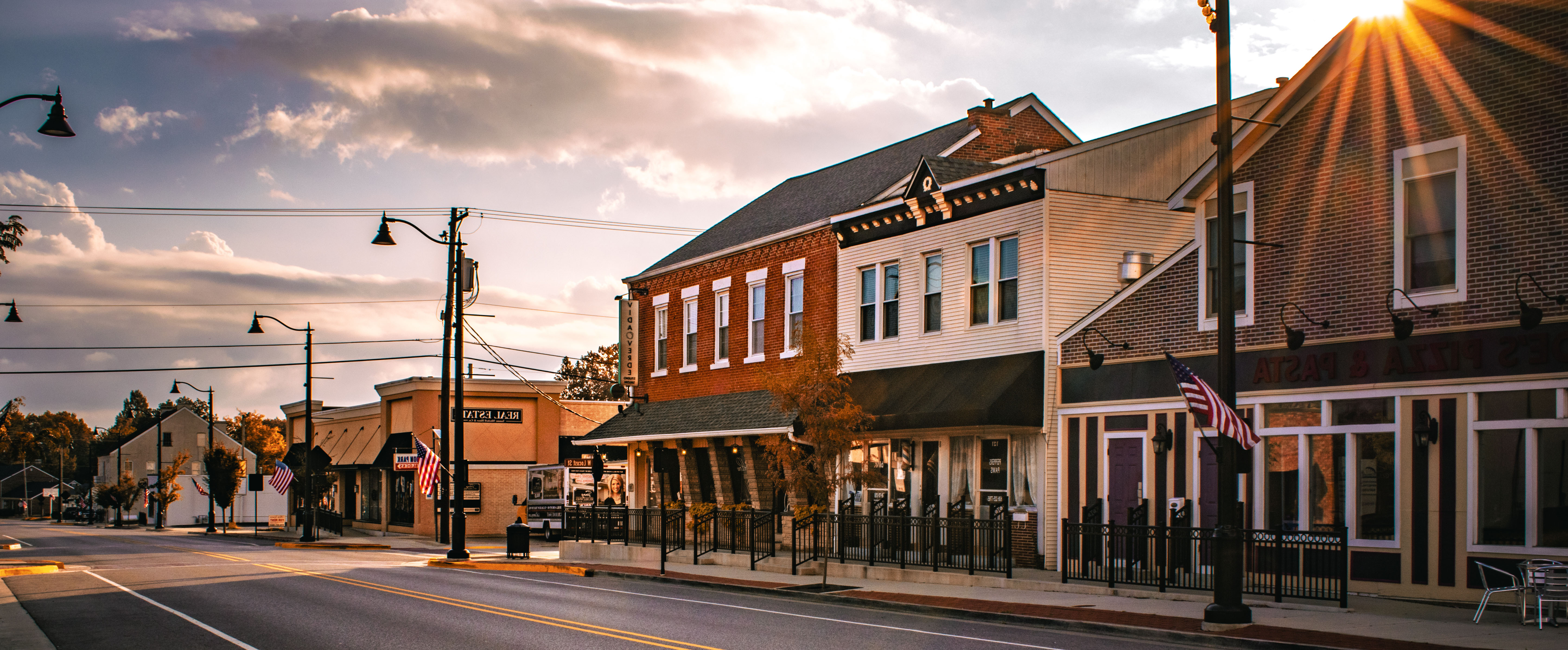 American small business main street at golden hour with veteran-owned businesses